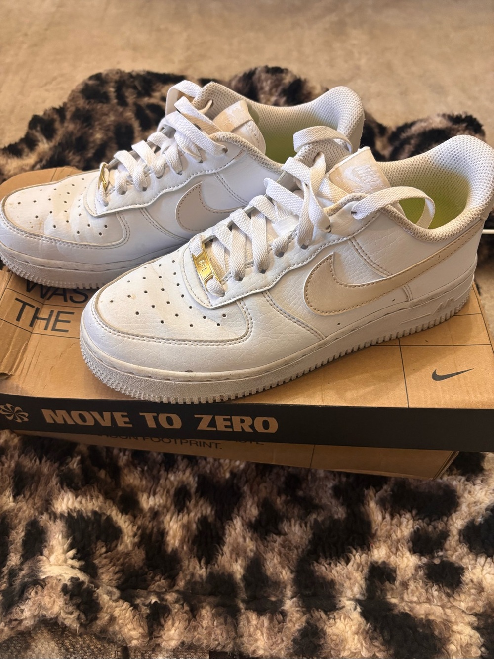Nike White Low-Top Sneakers with Gold Accents